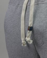 SZÜRKE FÉRFI MELEGÍTŐ NADRÁG